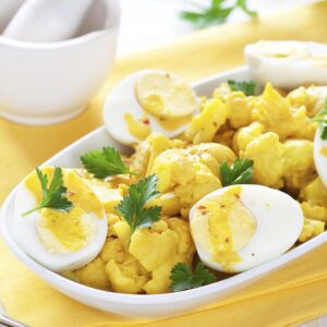 Coliflor con bechamel bacalao y huevo cocido